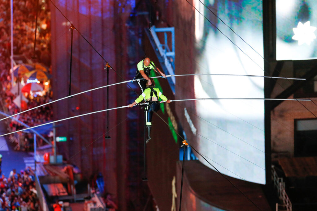Aerialist wallenda walks the highwire with his sister lijana over times square in new york