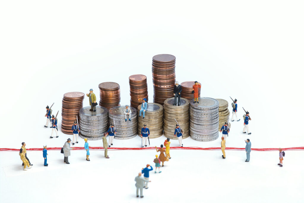 Miniature soldiers guarding coin towers