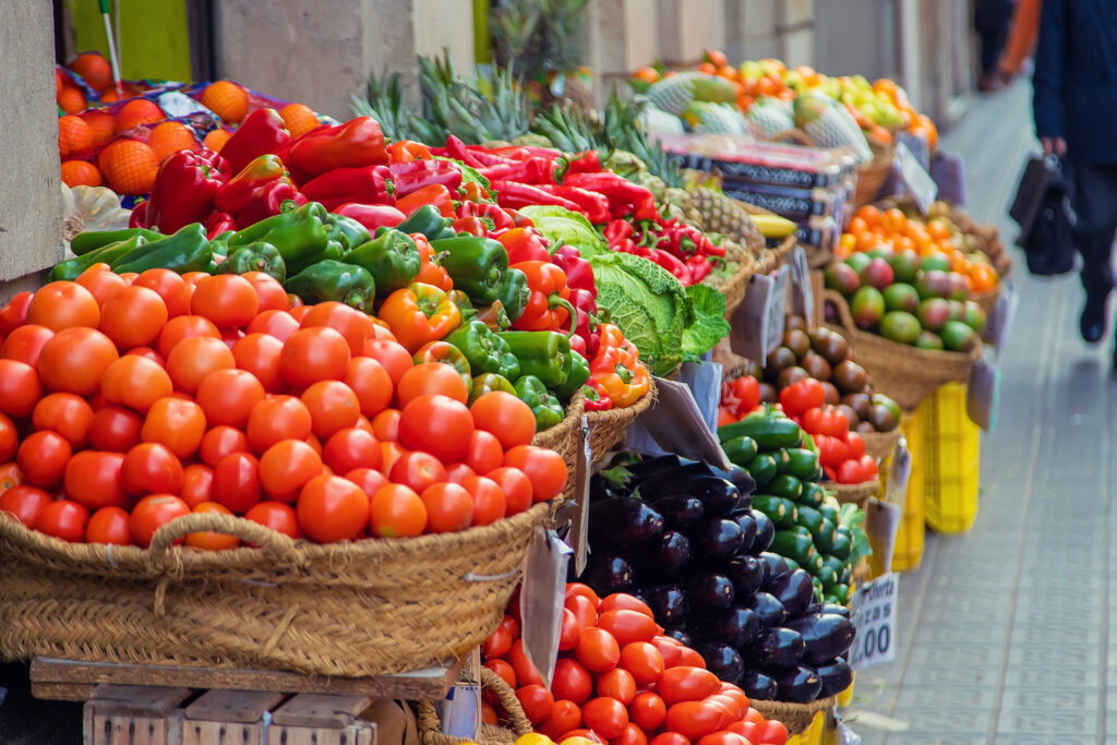 Market stalls with vegetables and fruits. selective focus.